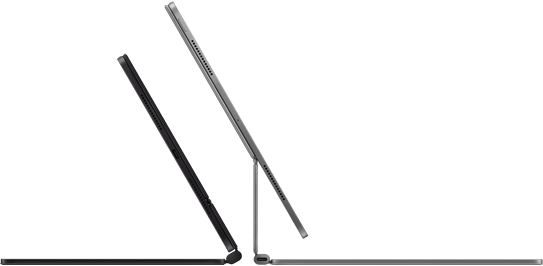 Dos Magic Keyboards adheridos a dos iPad Pro, uno contra otro, en negro espacial y color plata