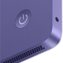 Vista posterior de la iMac que muestra la entrada para audífonos, la rejilla del sistema de bocinas y el botón de encendido