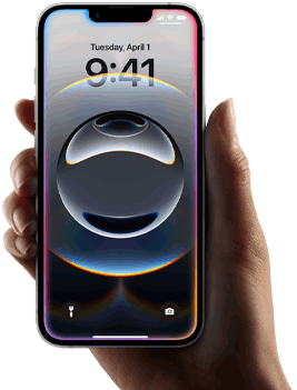 Una mano sostiene un iPhone 16e. Un brillo suave y colorido rodea la pantalla de borde a borde